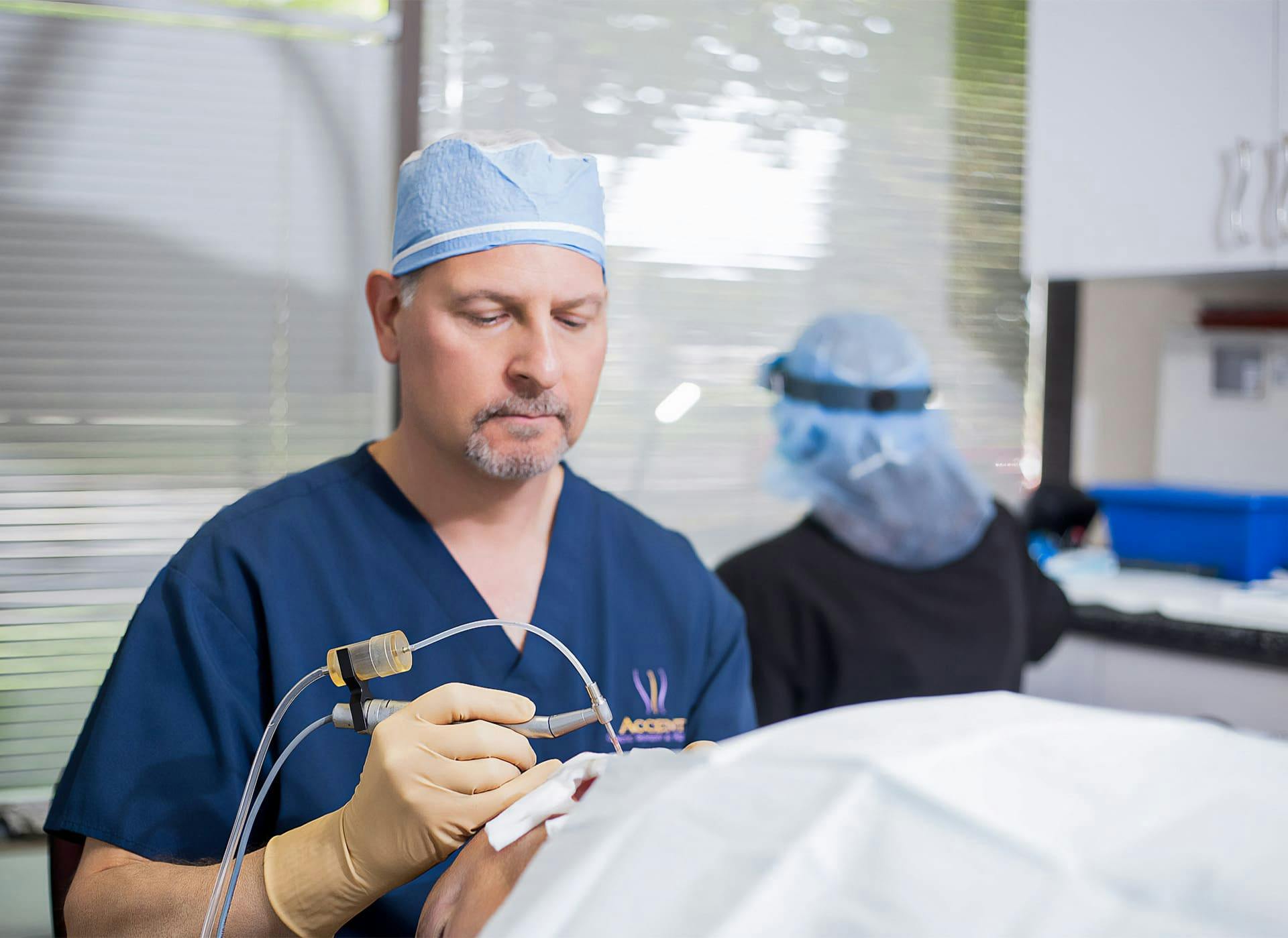Dr. Berkowitz doing procedure on patient