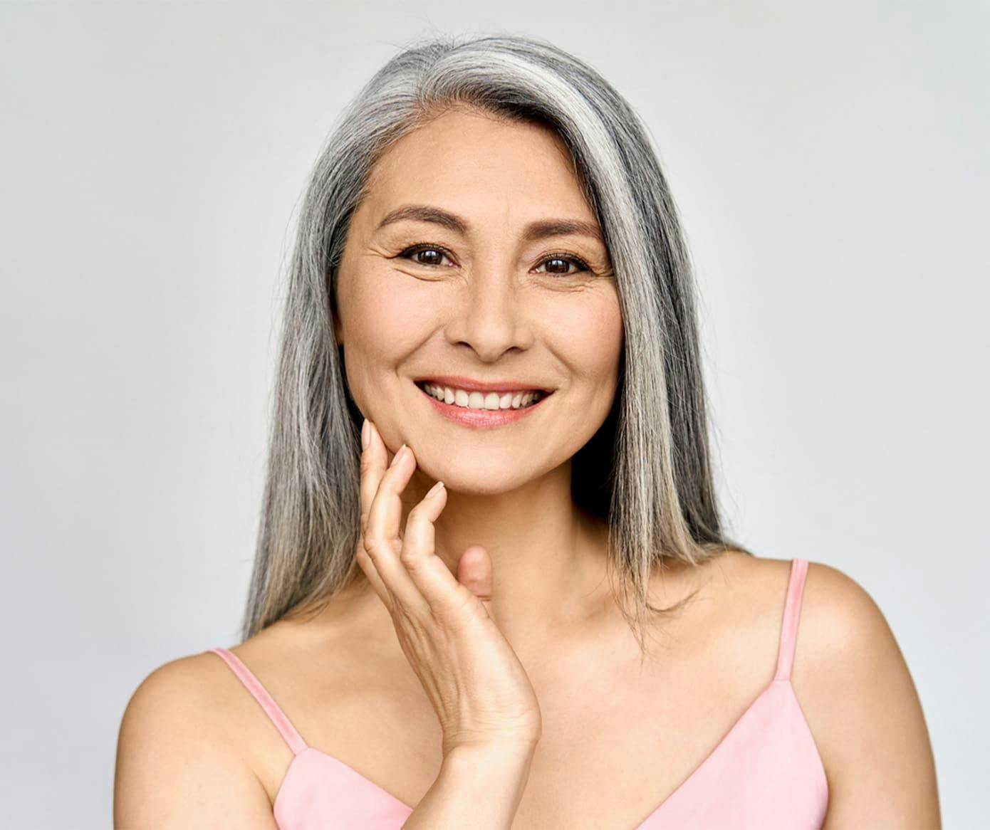 woman with gray hair in pink tanktop