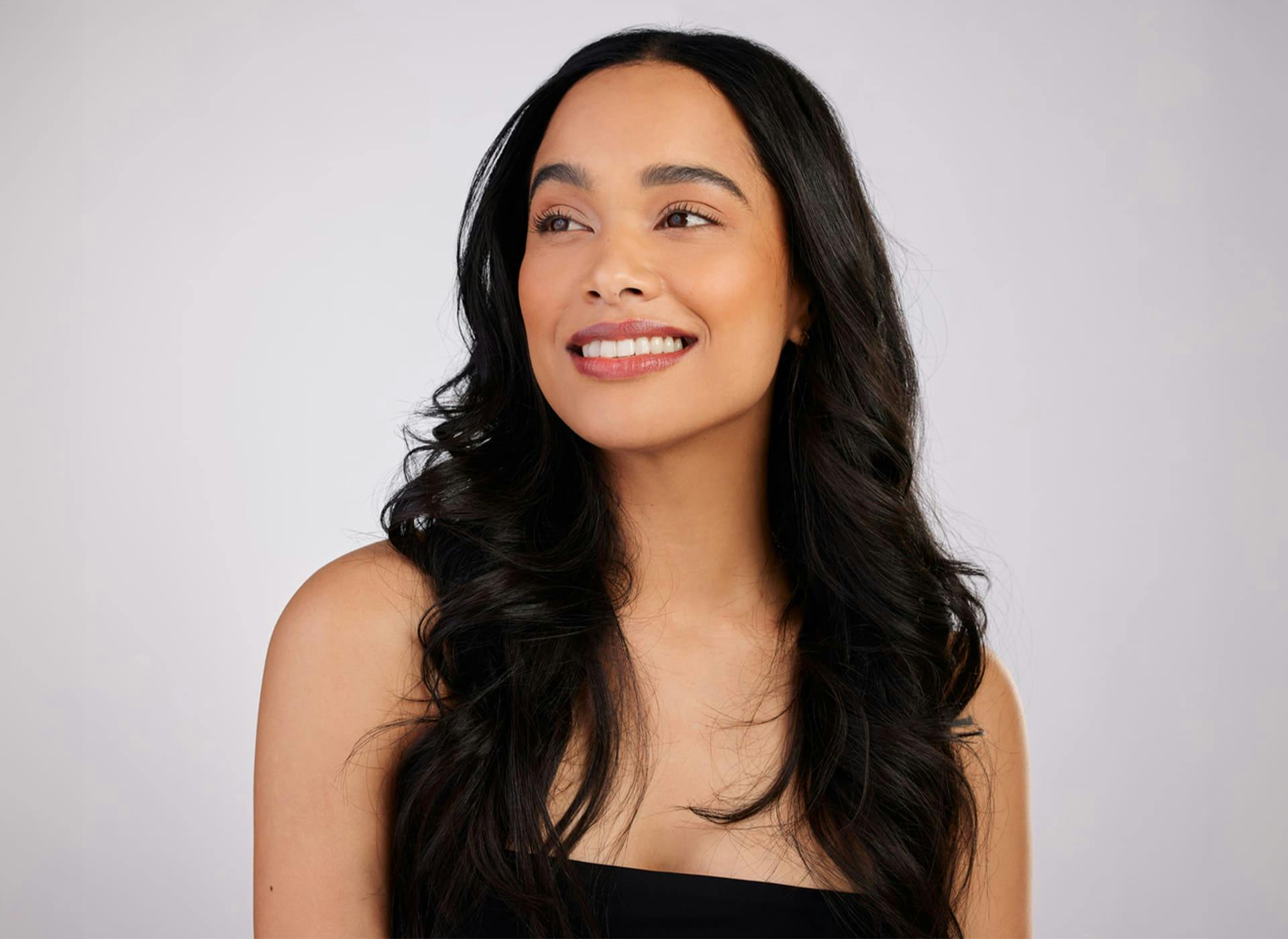 woman smiling and looking to the left