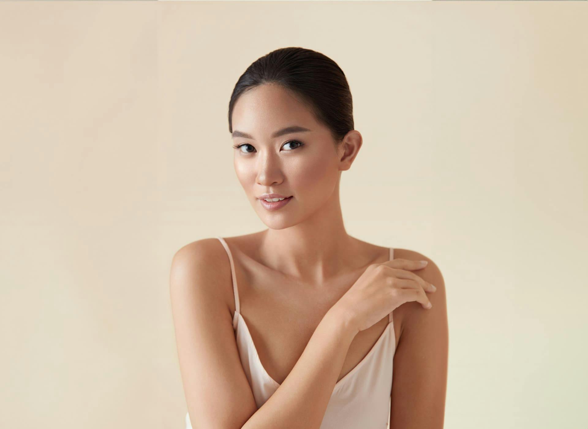 woman looking forward in white tanktop