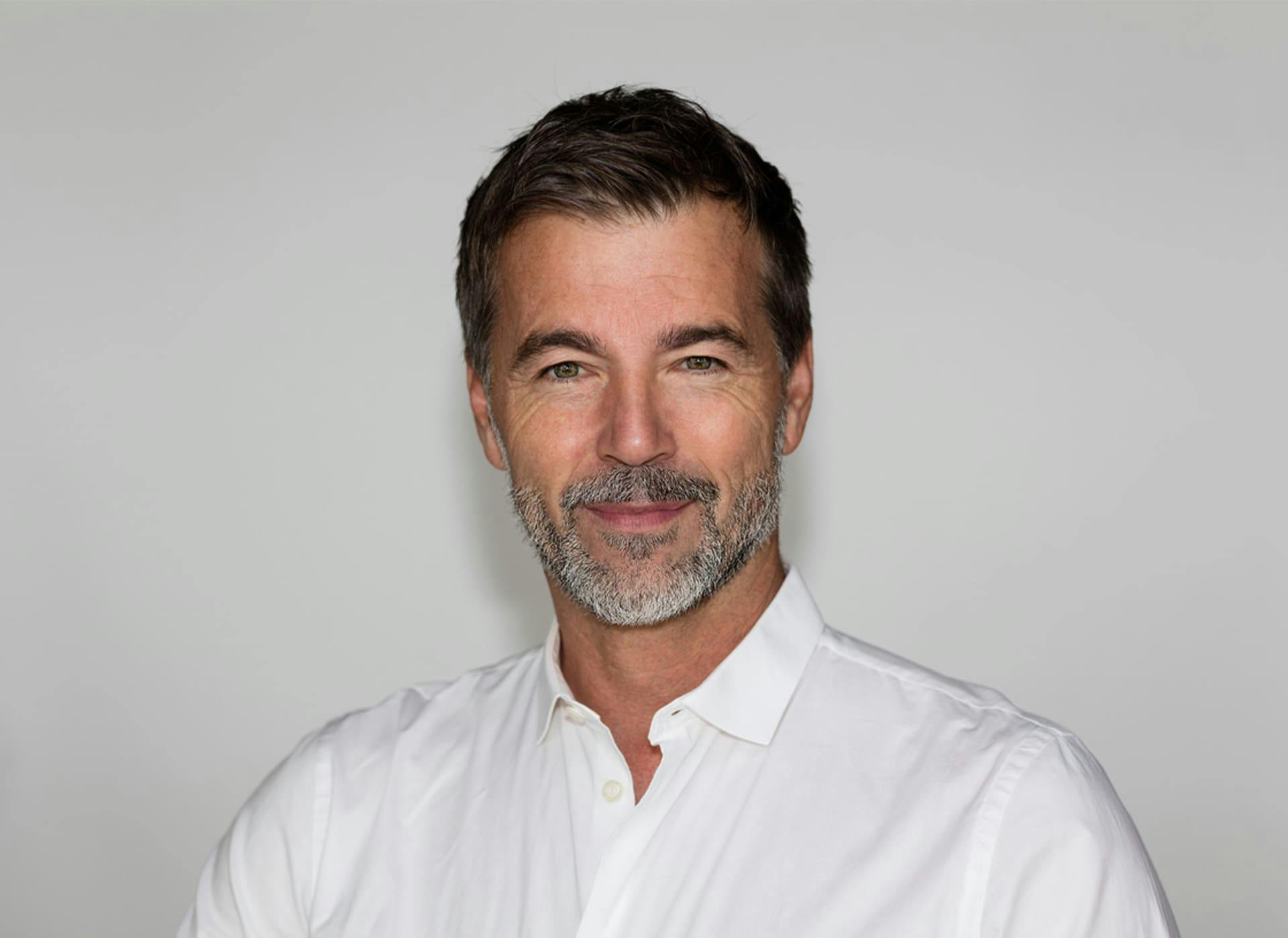 man smiling and looking forward