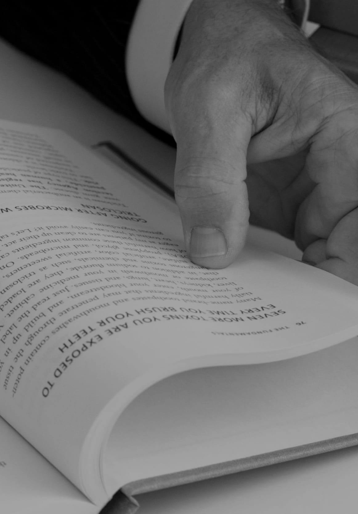 Dr. Gerry Curatola looking in a book