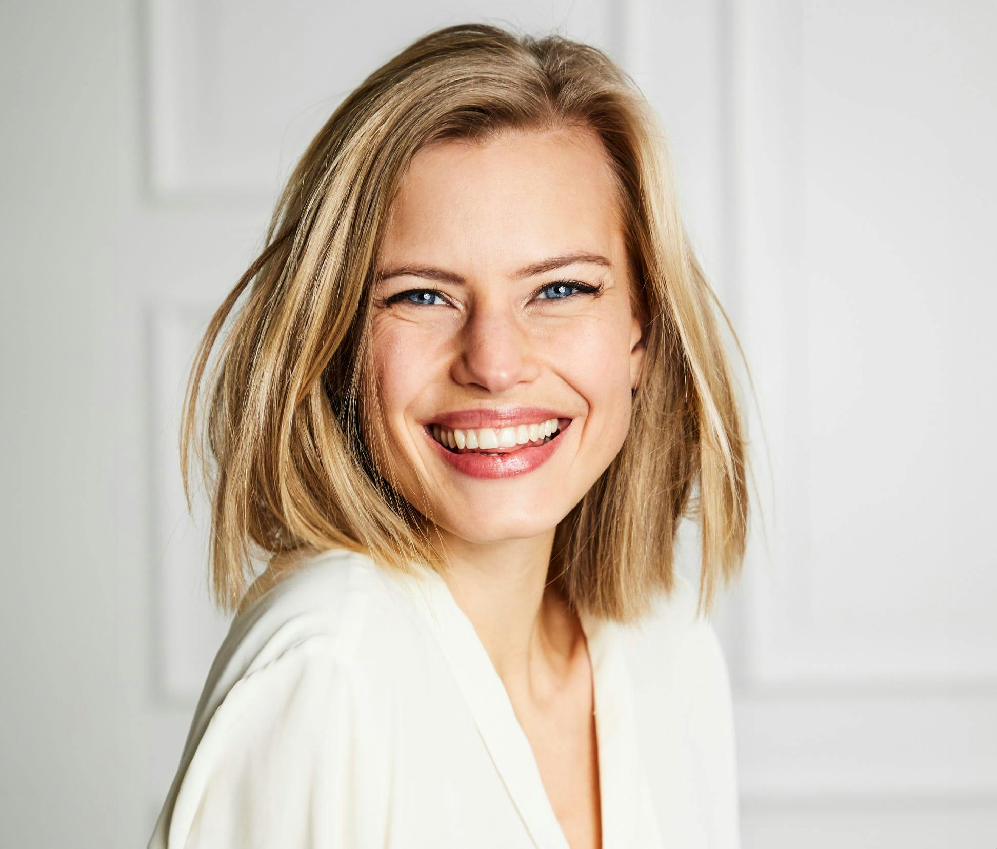 woman with short hair smiling