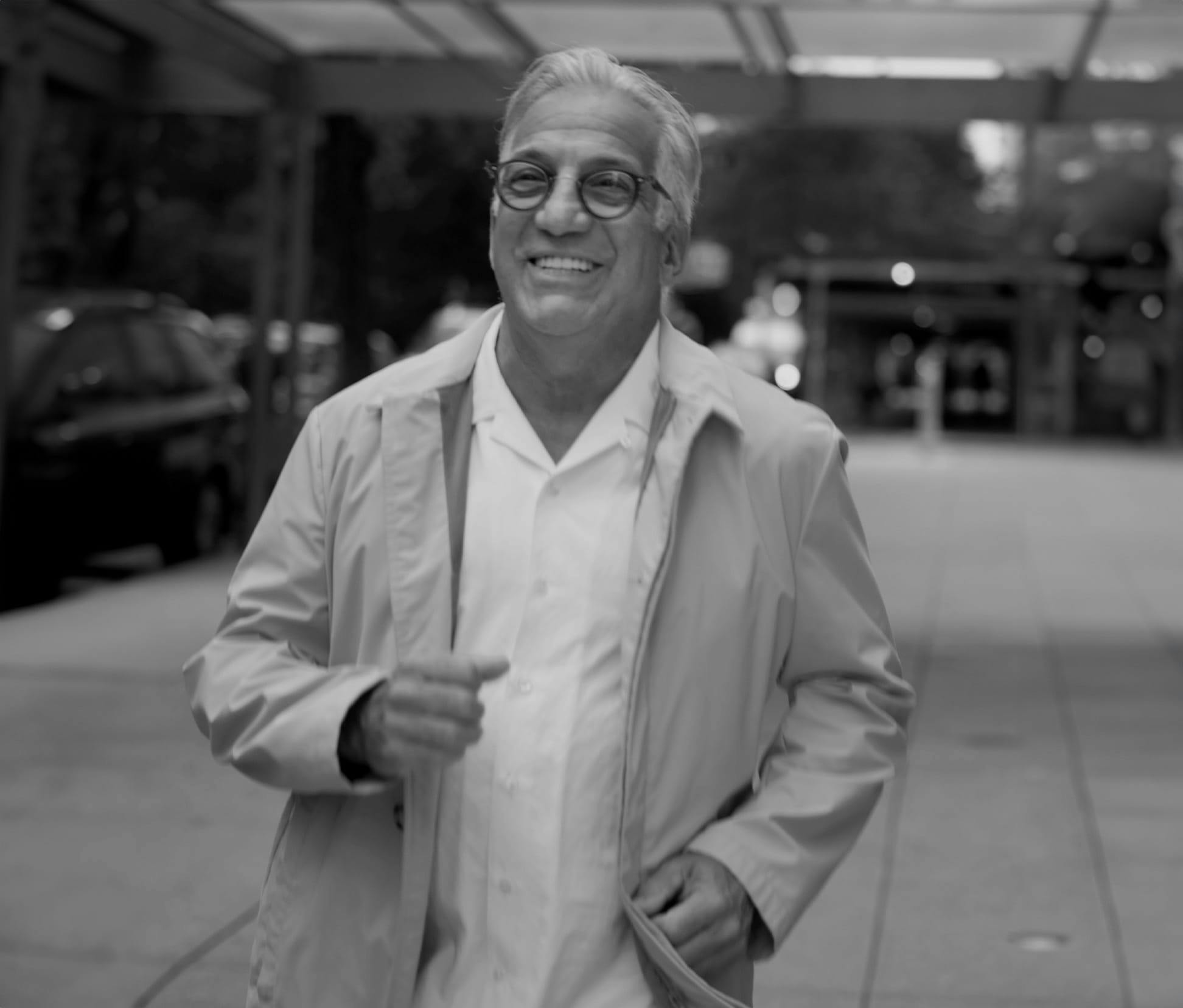 greyscale of Gerry Curatola walking on sidewalk