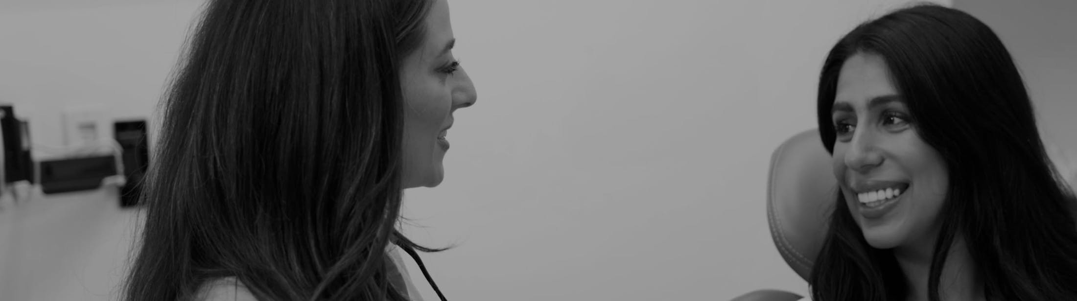 patient and female dentist smiling