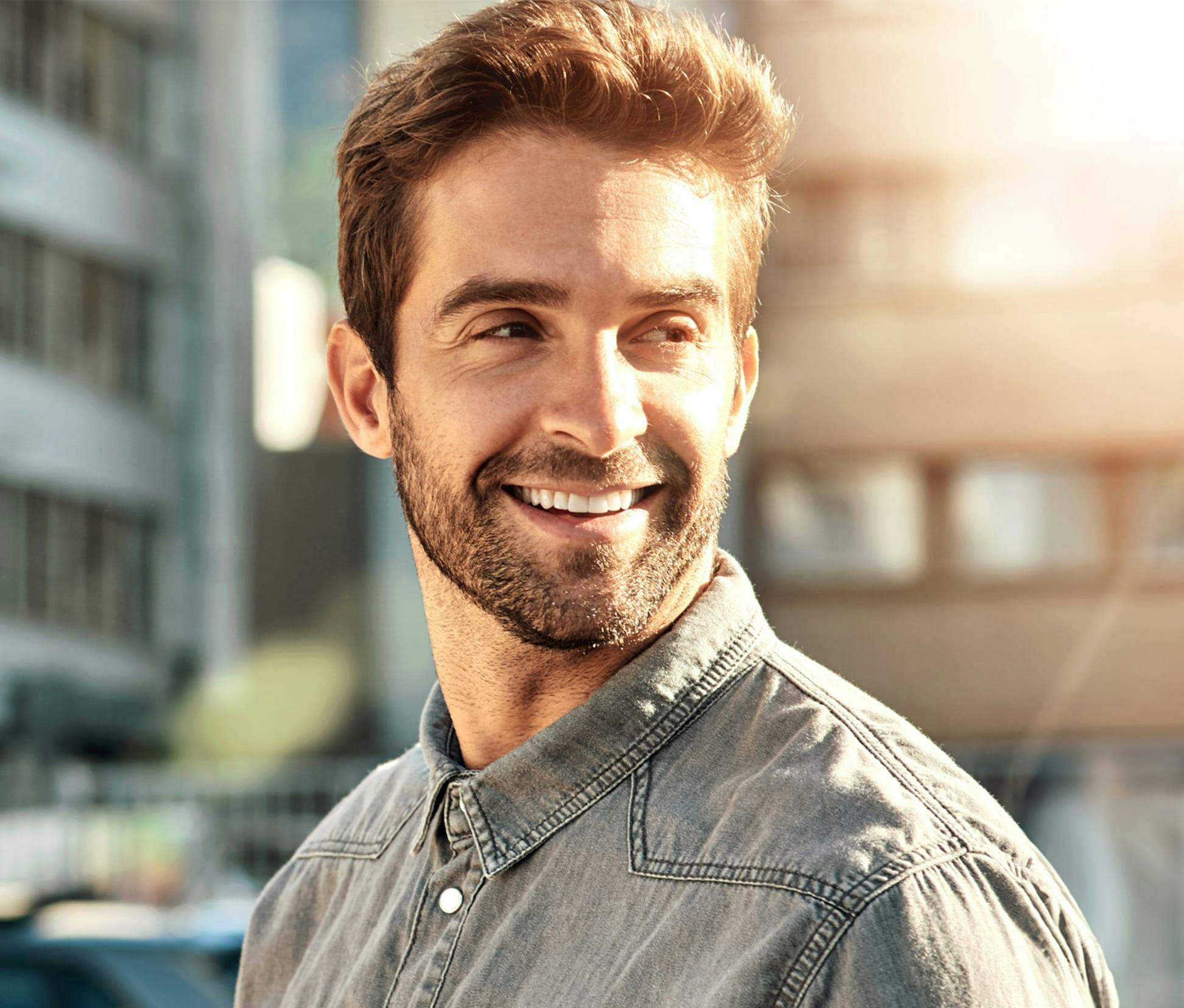 man smilling with sun hitting the right side of him