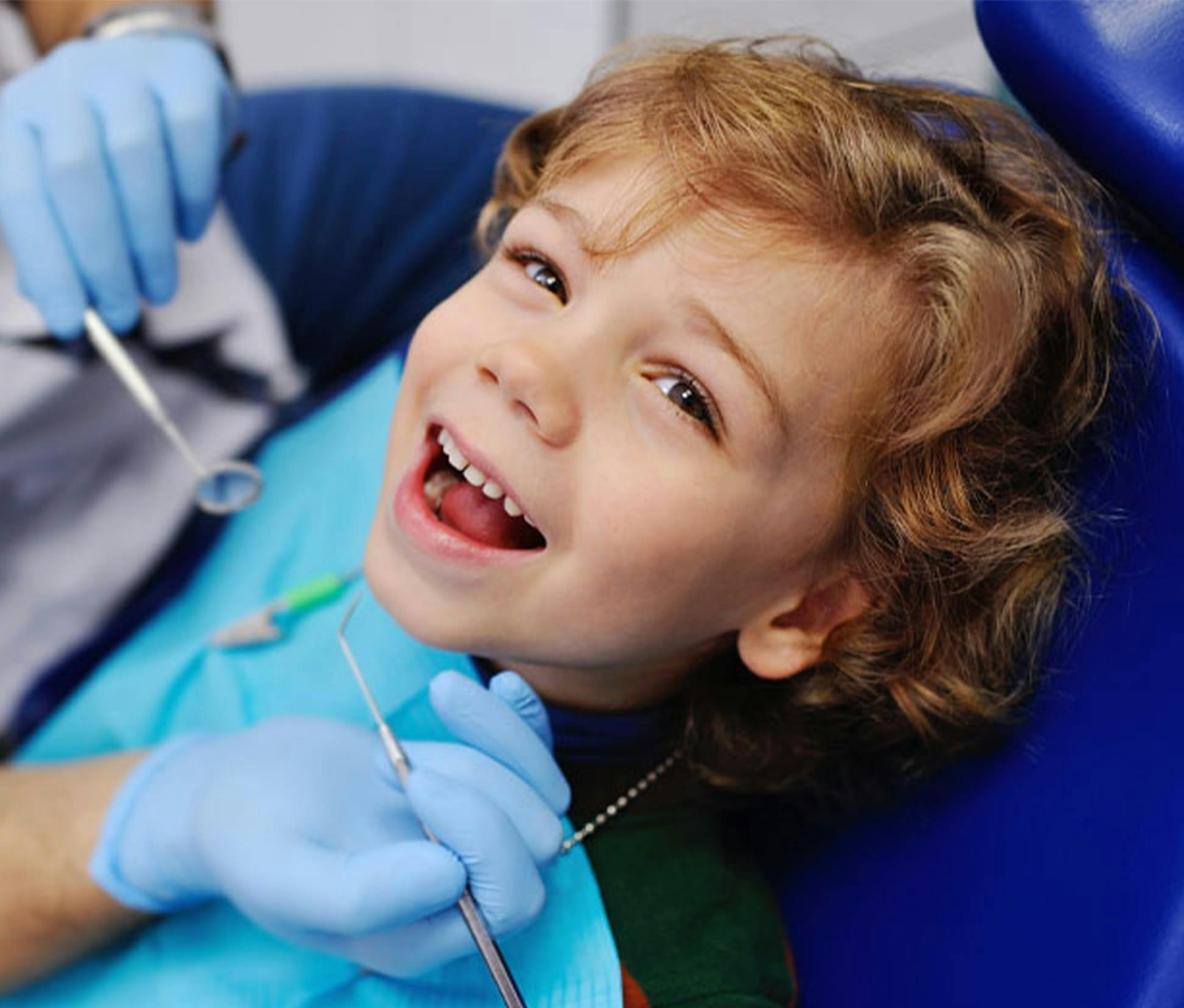 young child getting a dental cleaning
