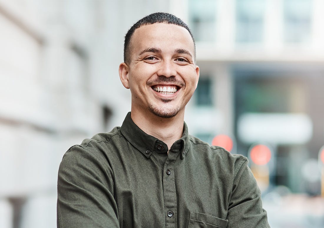 man in a green button up shirt