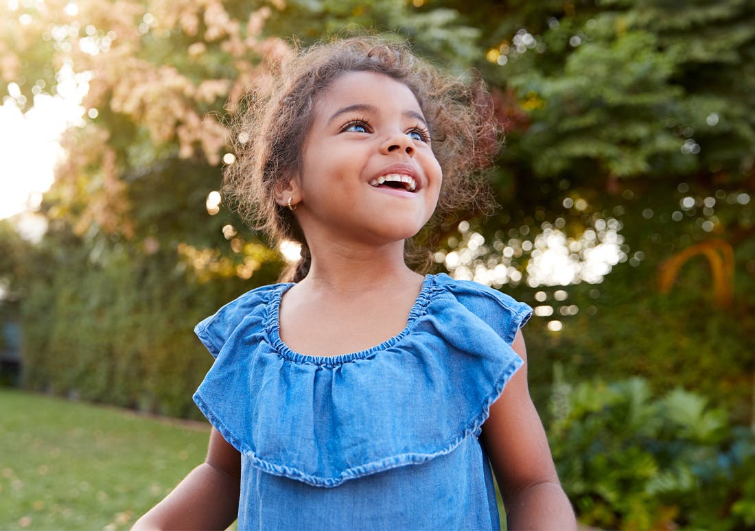 young girl in a blue denim outfit