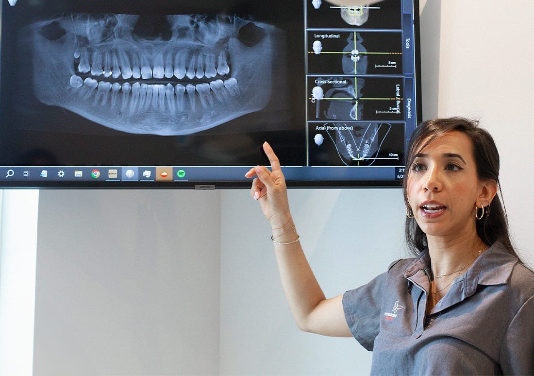 dentist pointing at an xray