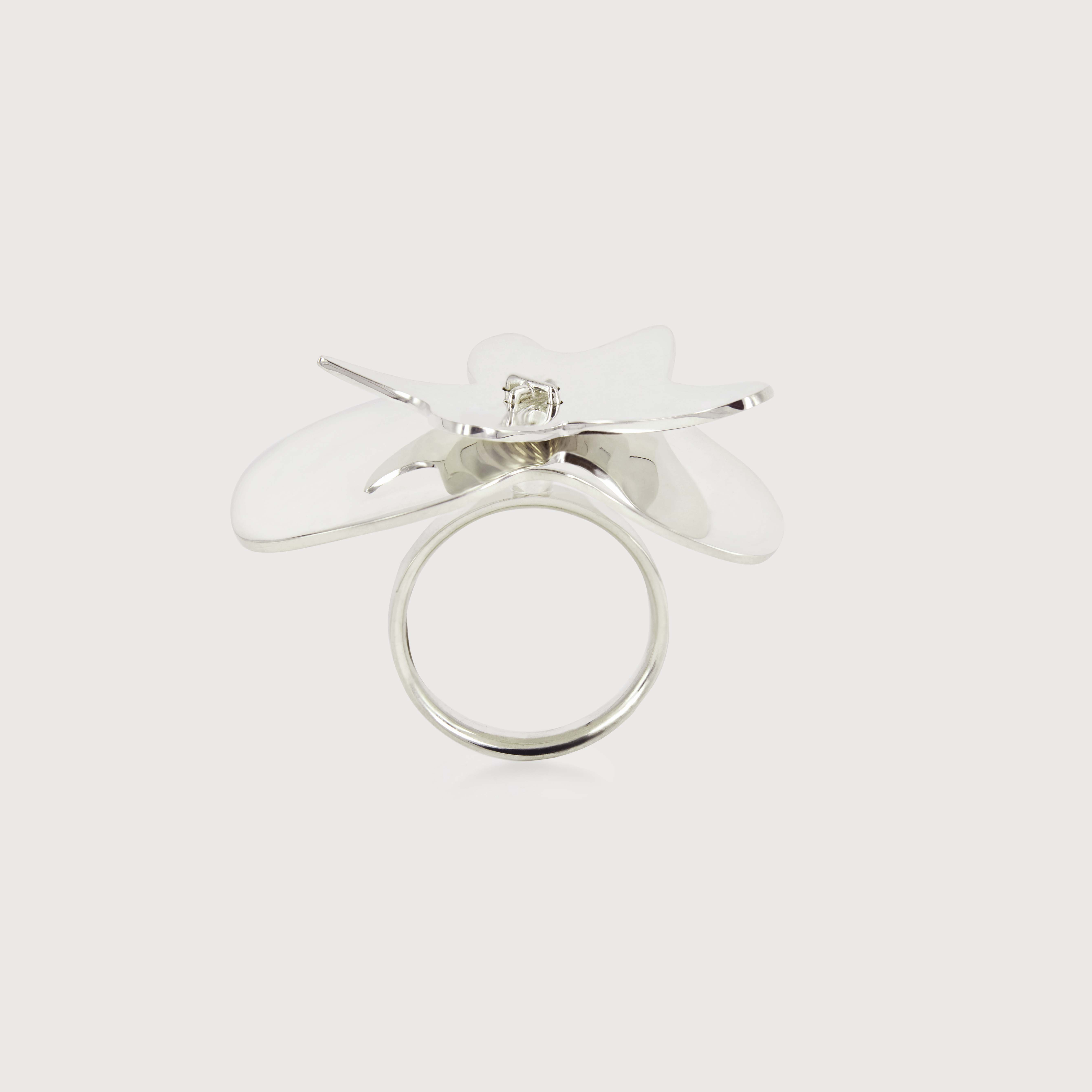 A ring showcasing two uniquely shaped sterling silver layers floating on top of each other.