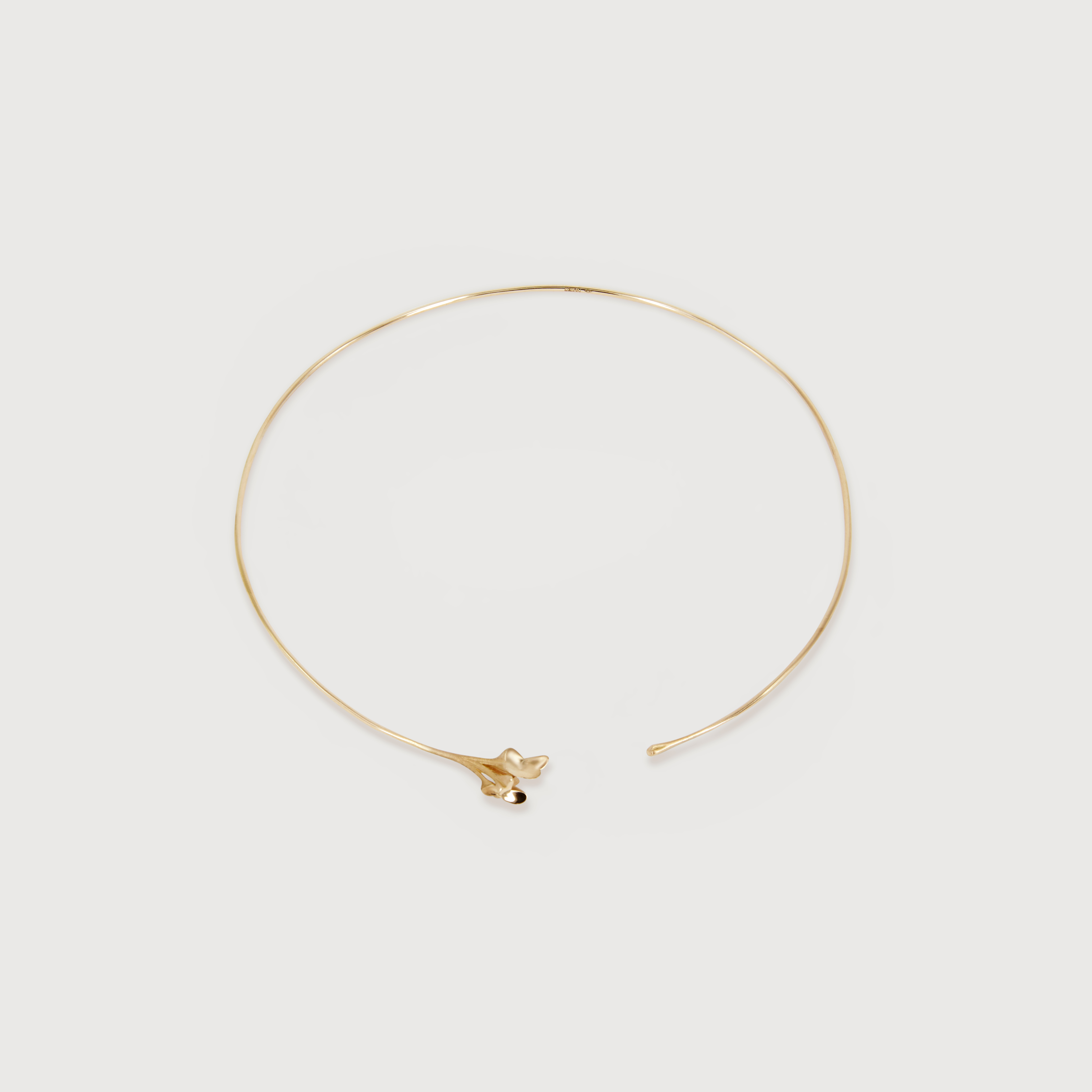 rose gold choker designed like a stem of a flower elegantly wrapping around