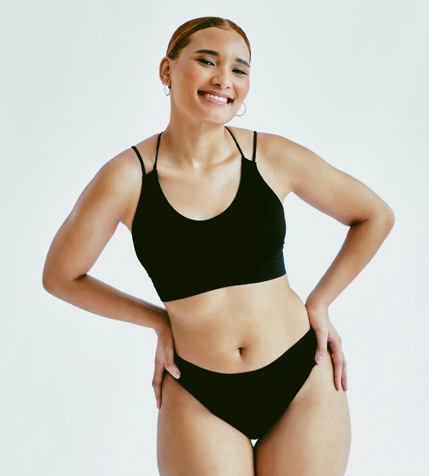 woman smiling with both hands on her hips