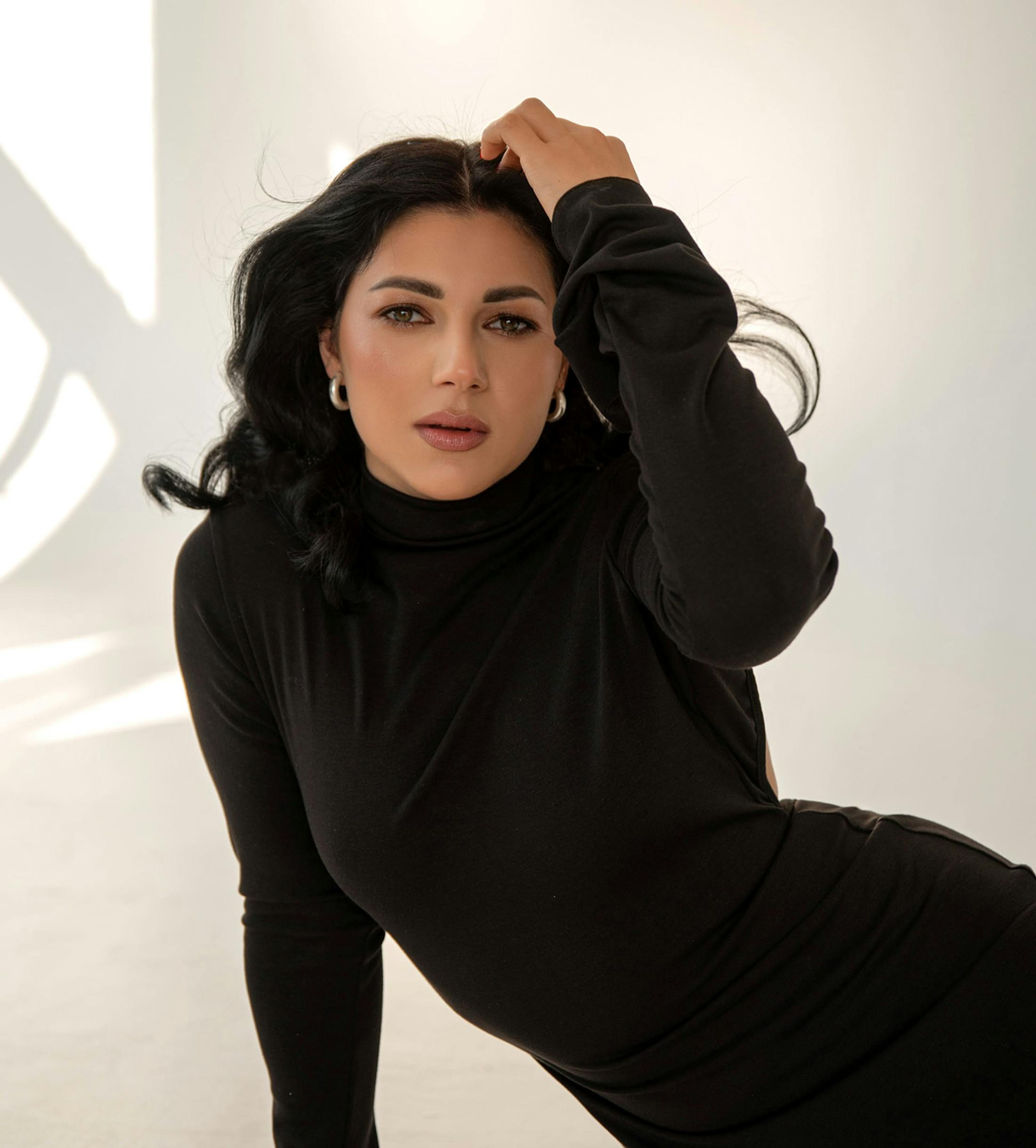 woman in black turtleneck dress