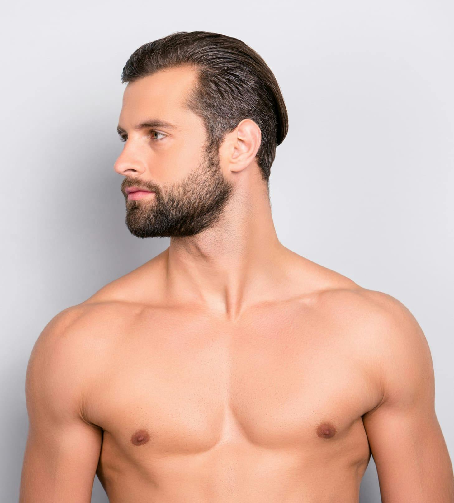 man looking to the left while shirtless