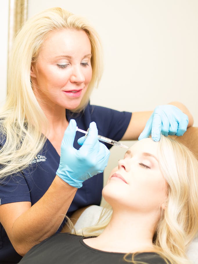 Dr. Criswell doing a botox treatment with a patient