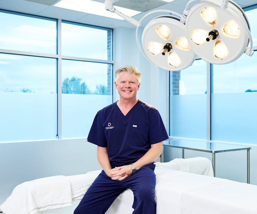 Dr. Bryan Criswell sitting on table