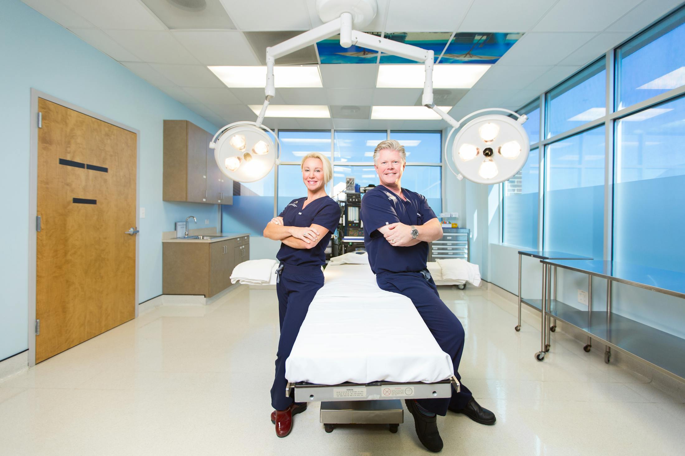Dr. Bryan Criswell and Dr. Kara Kane Criswell in operating room