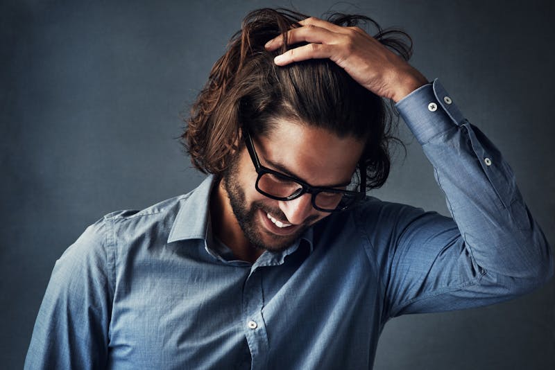 Man with full head of healthy hair and happy good skin