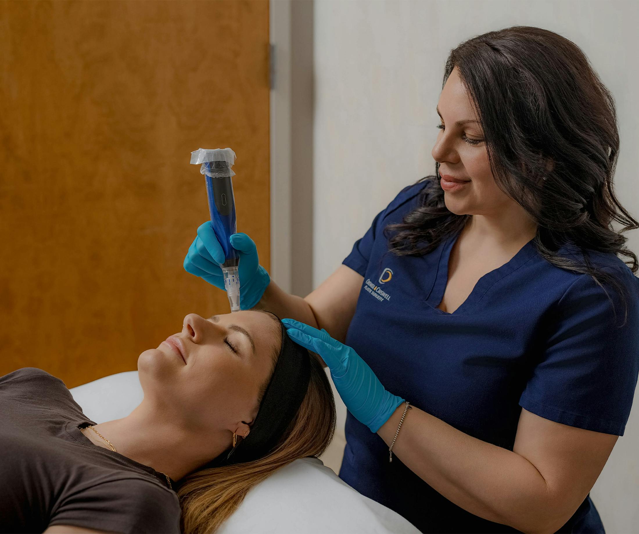 woman receiving microneedling treatment