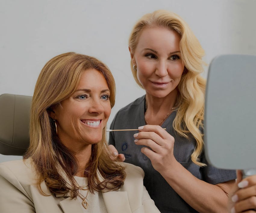 doctor with patient pointing at face