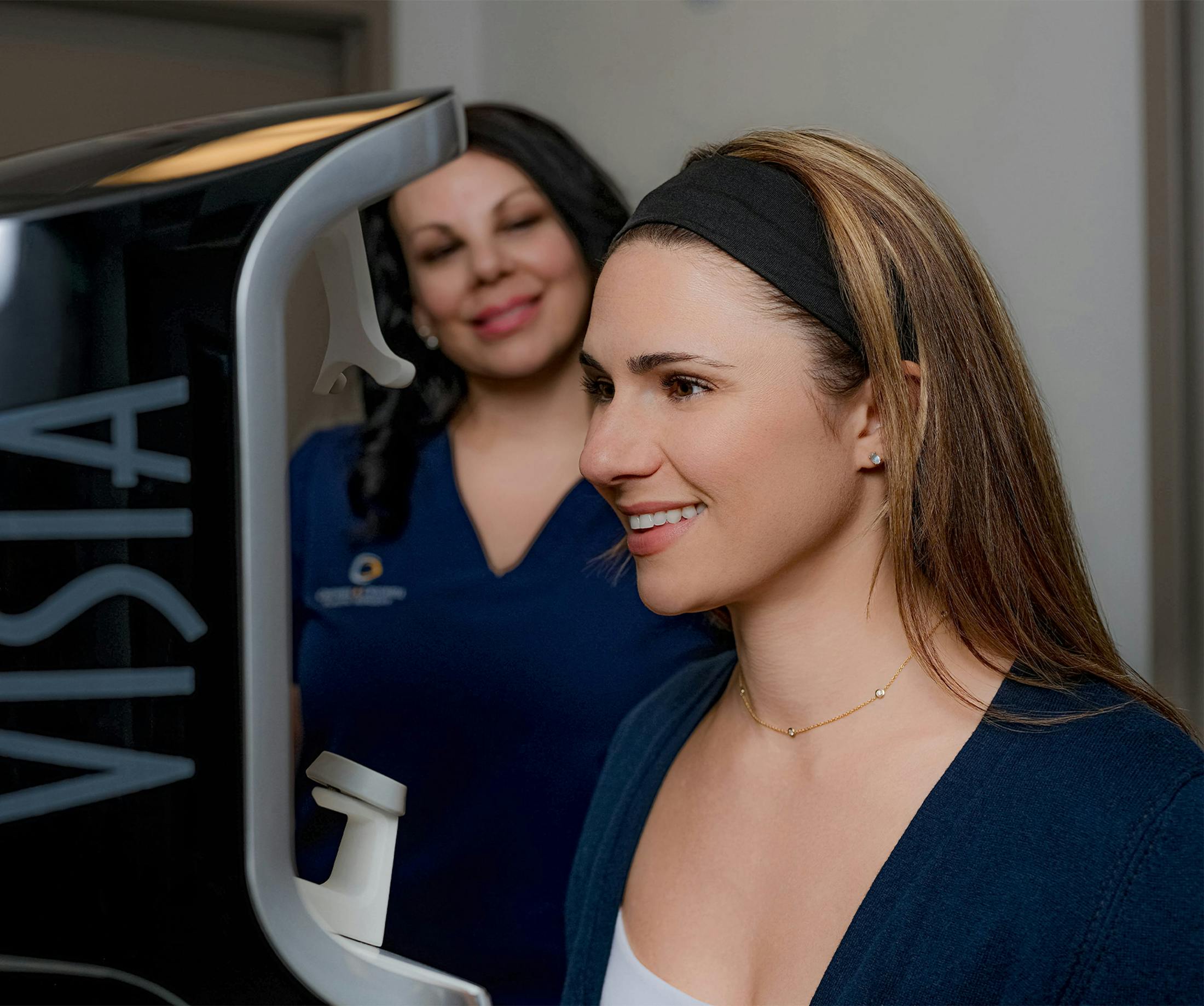 woman standing in visia skin analysis machine