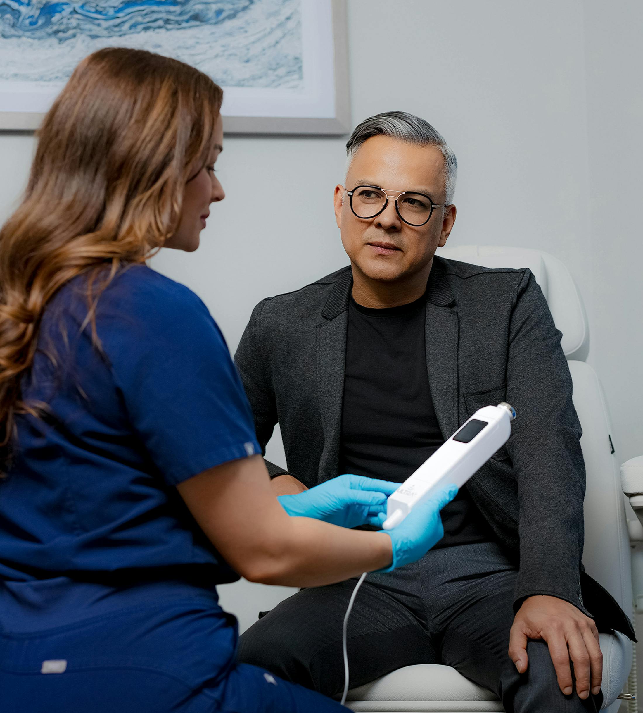man siting with provider talking