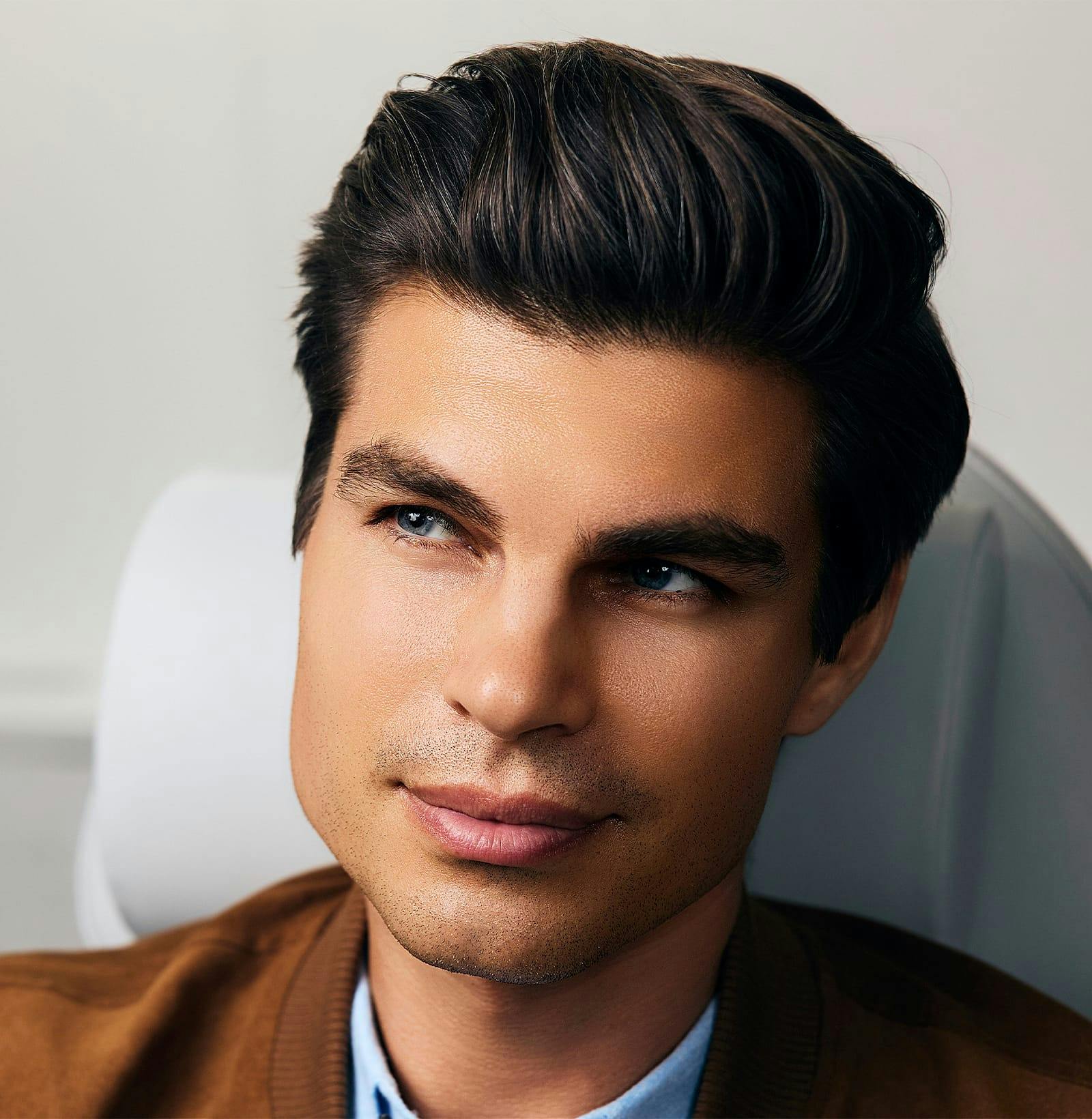 close up of man's face seated in medical chair