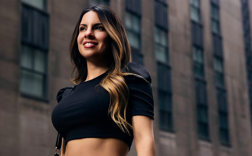 woman in street wearing a black crop top
