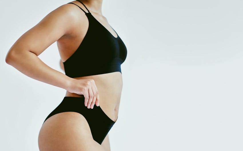 side view of woman in black underwear