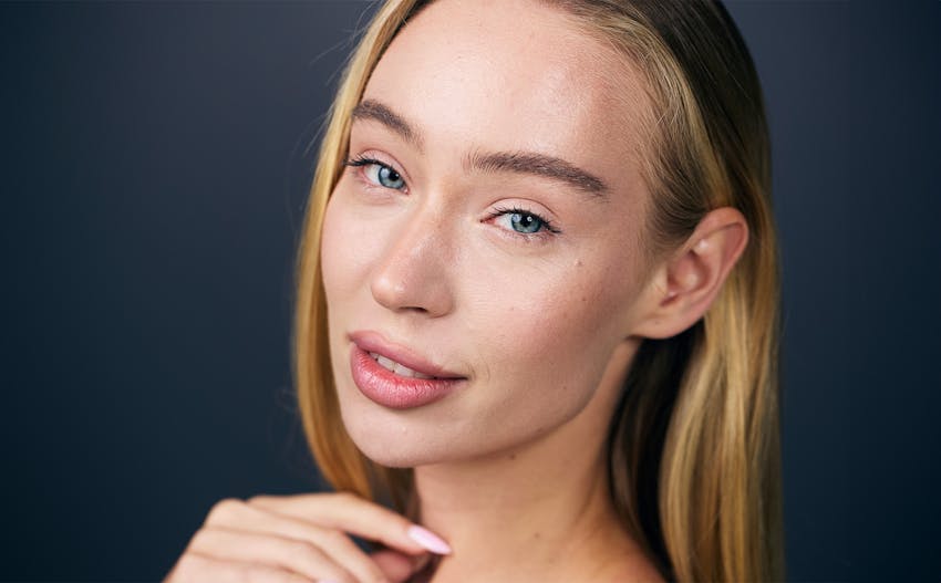 close up of a woman's forehead and eyes