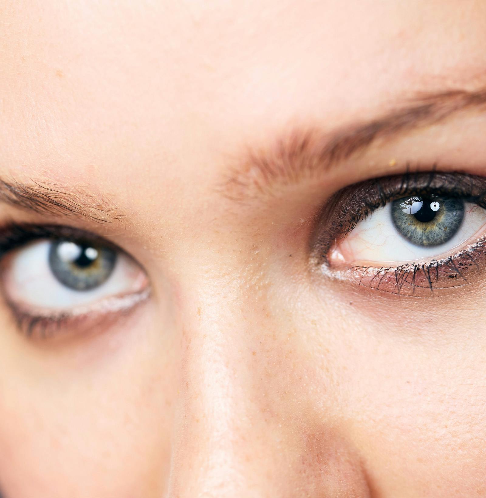 close up of woman's face as she looks towards camera