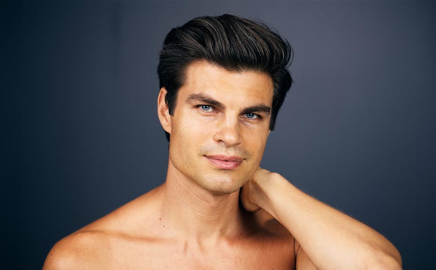 man in brown sweater