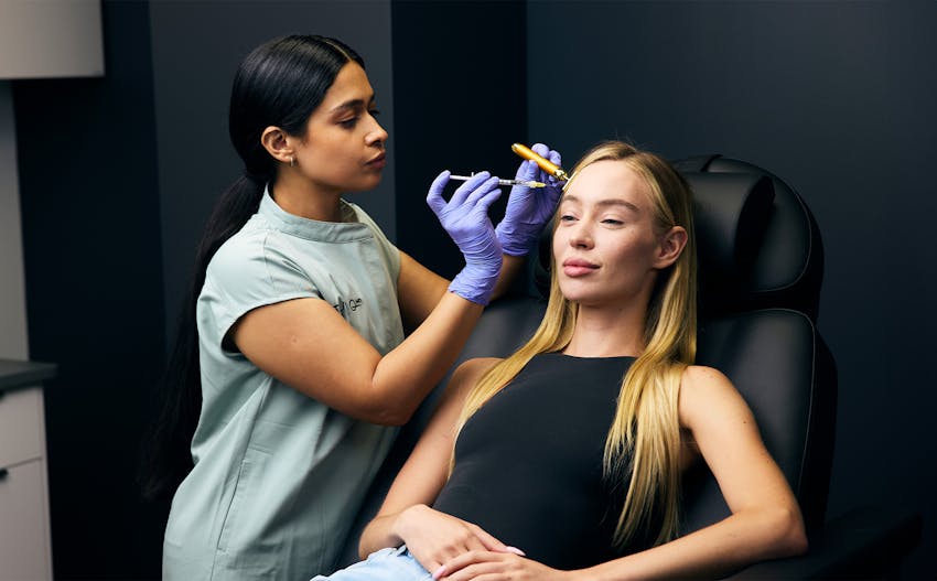 woman recieving botox injections in forehead