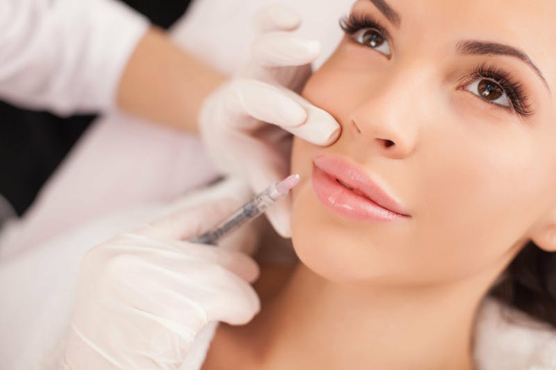 woman getting lip injections