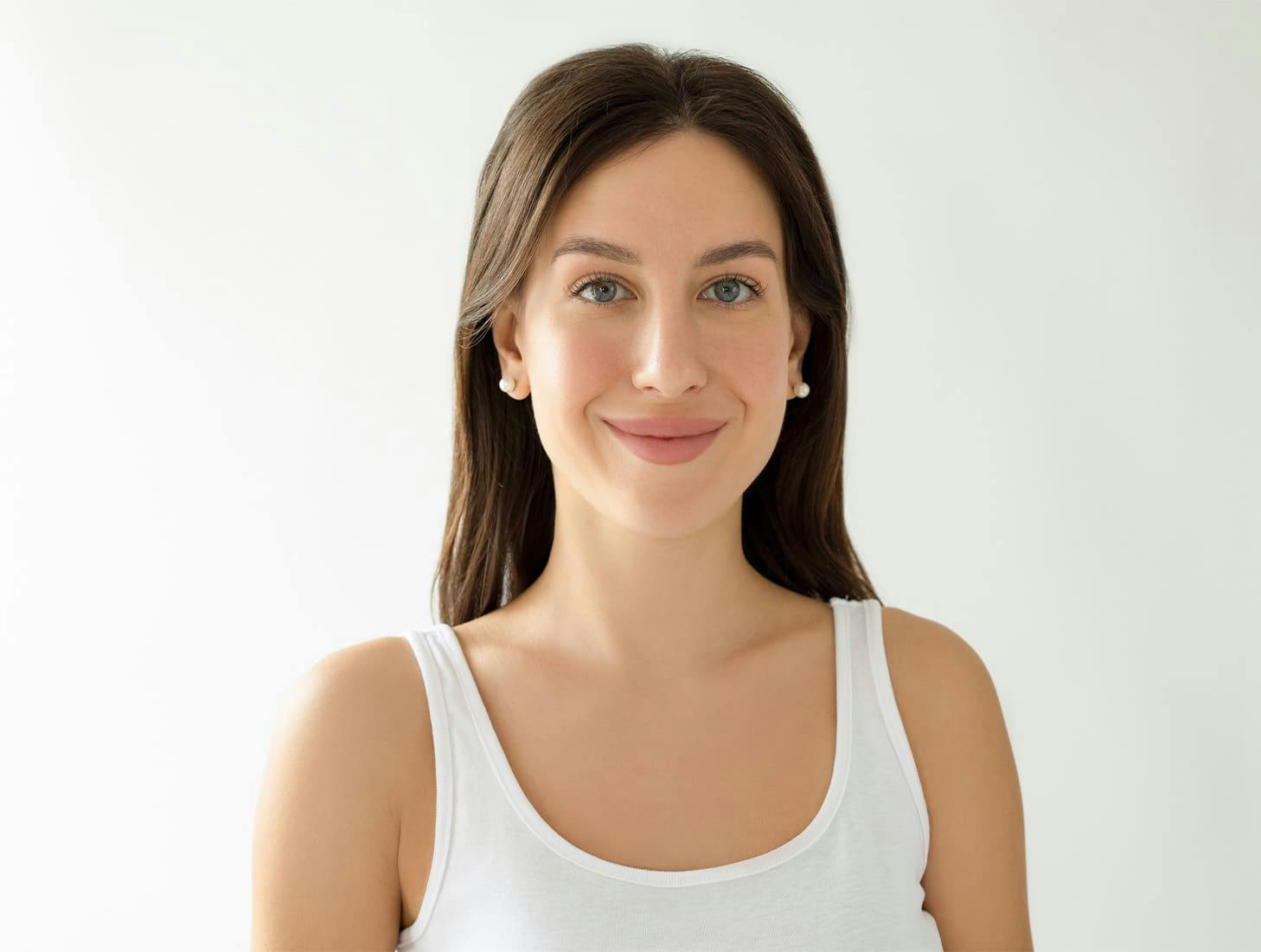 woman smiling in white tanktop