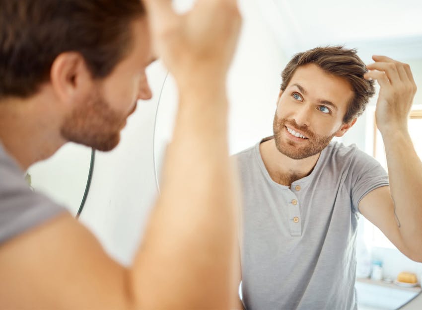 man looking in the mirror