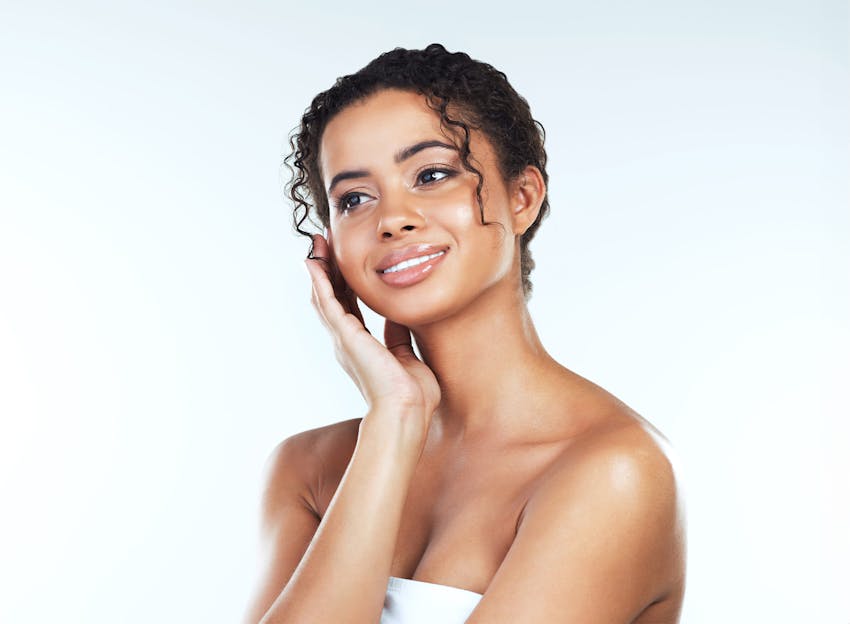 woman with curly hair smiling
