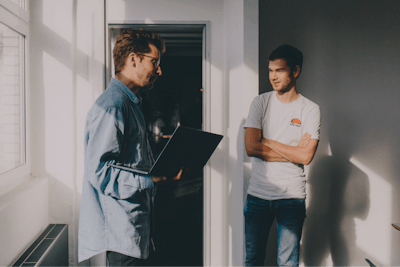 Two people talking in office
