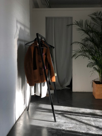 Jackets hanging in the office, hit by sunlight.