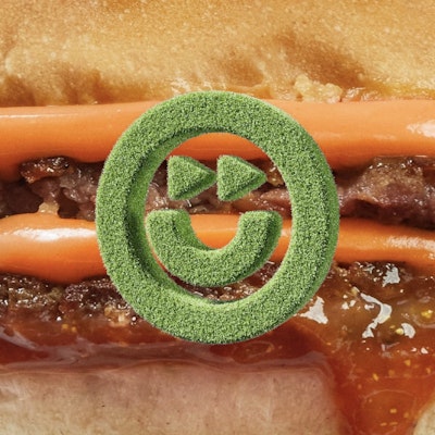 Future Farm Logo as a 3D render made of grass placed on a scaled up image of a vegan burger with sauce dripping out of it