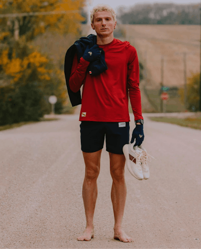 Runner standing in the middle of a road