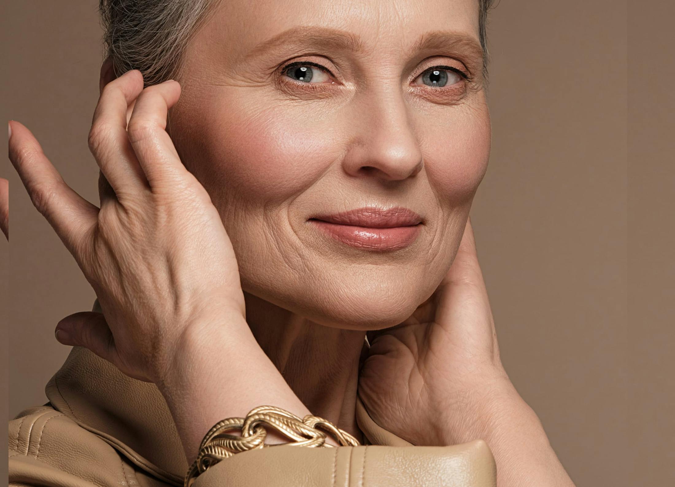 woman touching the side of her face