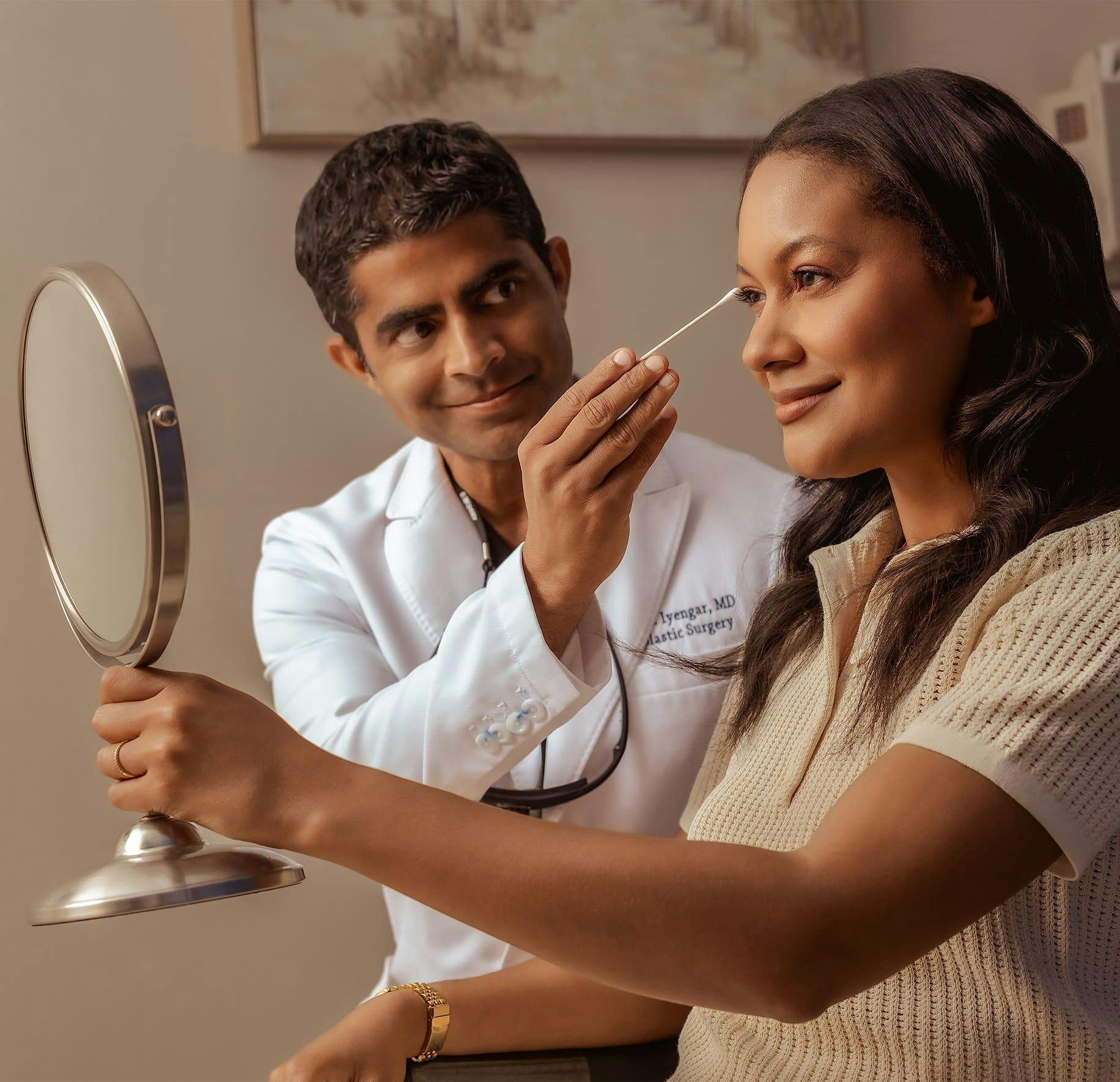 Dr. Iyengar looking at patient's eyelid