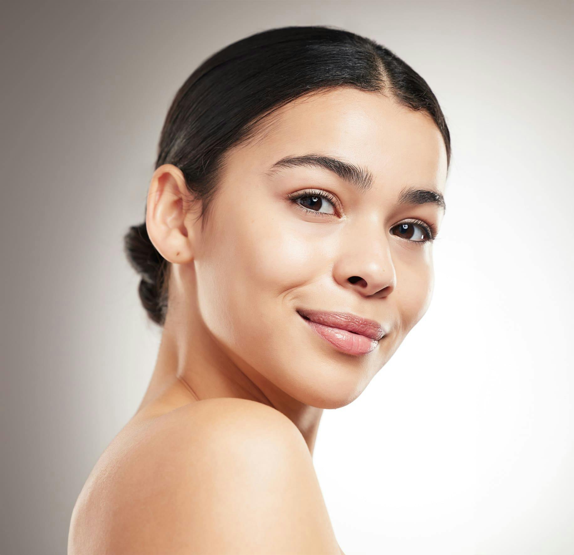 woman with her hair tied back