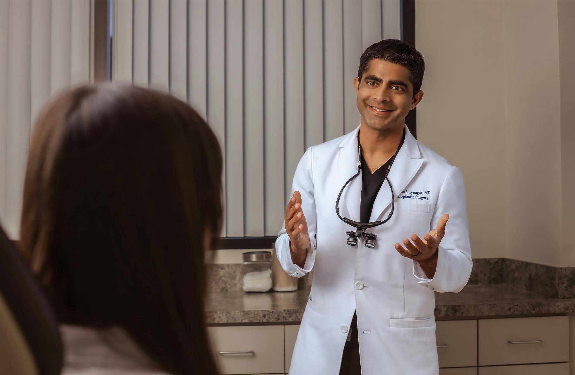 Dr. Iyengar talking to patient