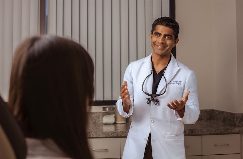 Dr. Iyengar talking to patient