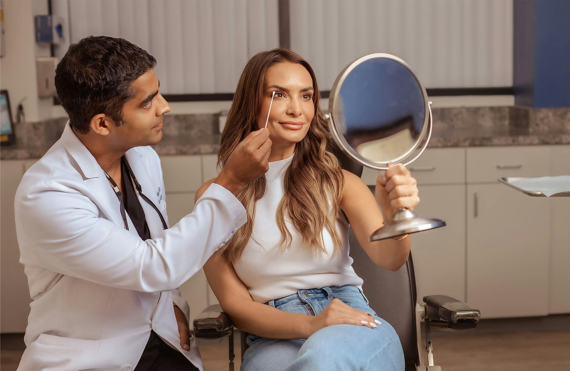 patient getting eyes checked by doctor