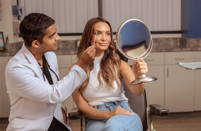 patient getting eyes checked by doctor