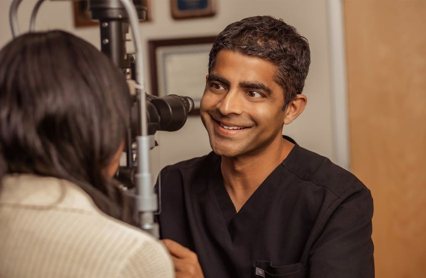 Dr. Iyengar smiling at patient
